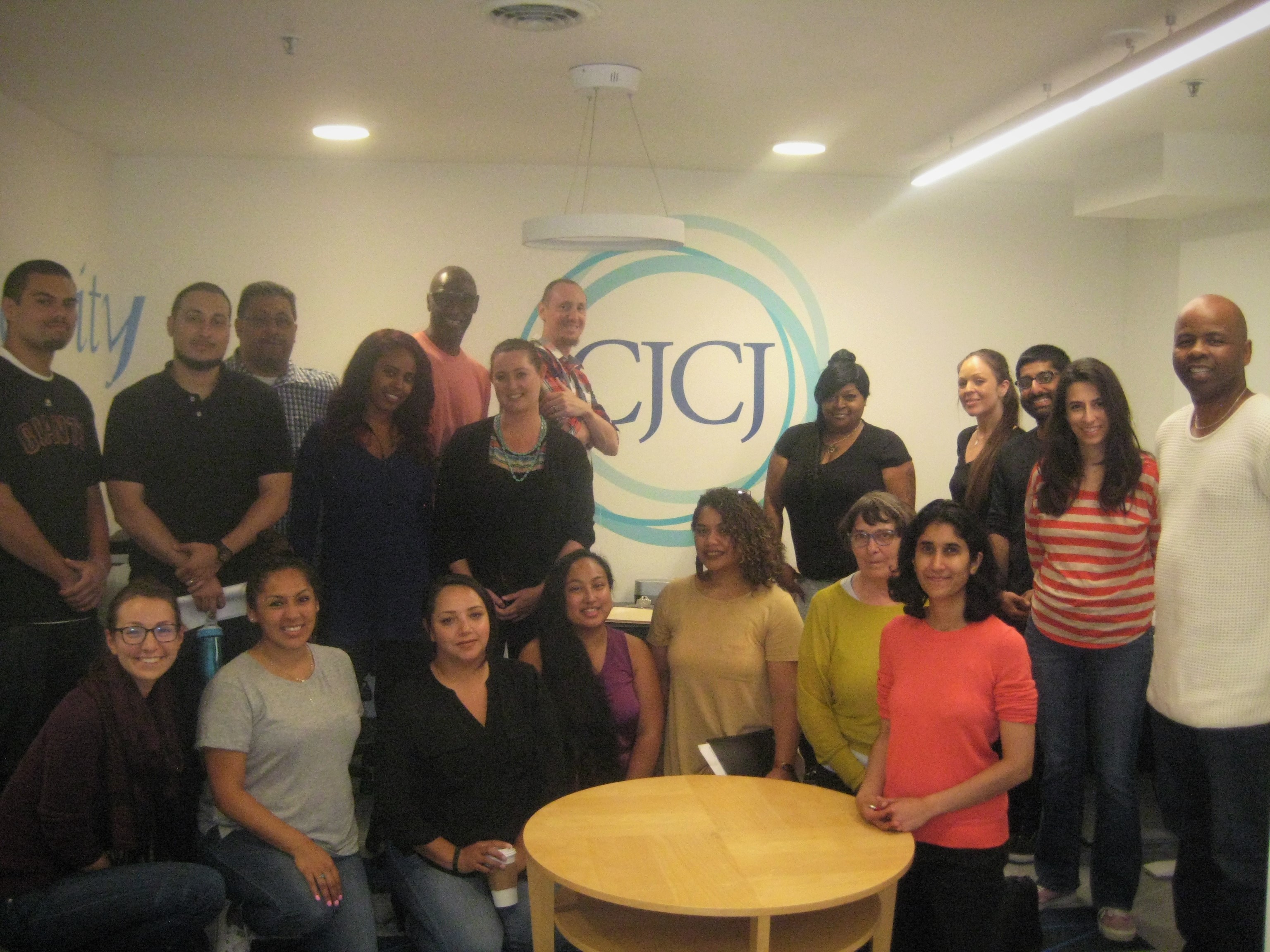 CJCJ staff members gather together in the new office space for the first time!