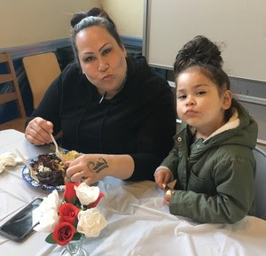 Cameo house participant and her daughter enjoy a meal together.