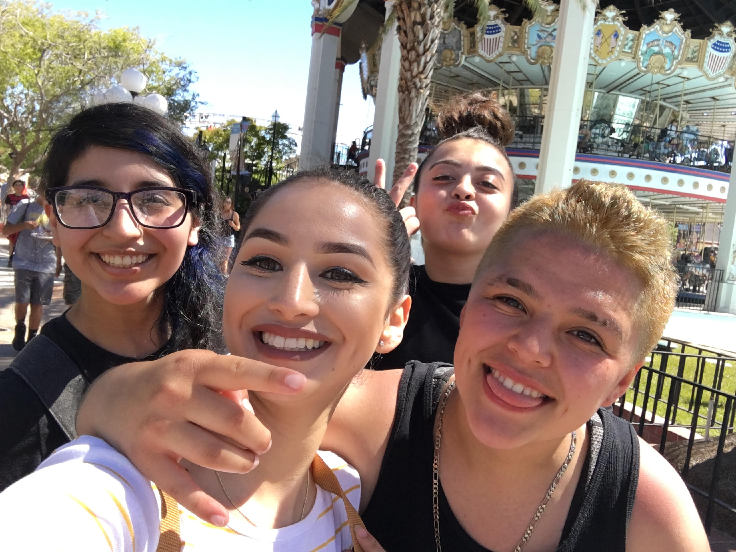 CJCJ Mentor, Elena, and her mentees take a fun photo together at California's Great America.